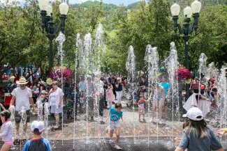 Summer kids in dancing fountain