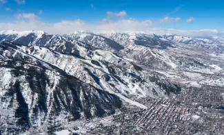 ariel shot of downtown aspen and aspen mountain